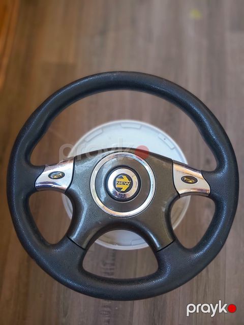 Opel Astra sükan - Material: qara teksturalı poliuretan/deri tərzində