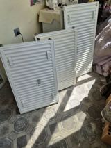 Ağ rəngli panel tipli istilik radiatorları. Məhsul metal korpuslu — Təmir və tikinti