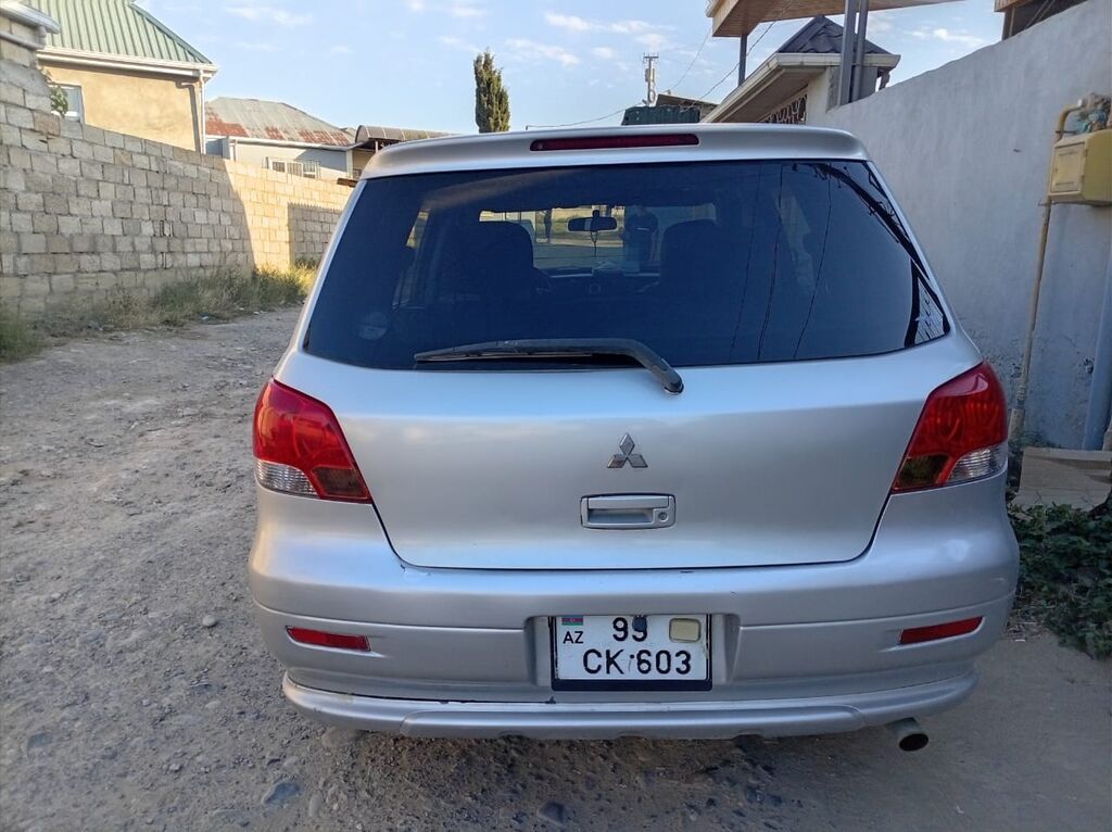 Mitsubishi Airtrek, gümüşü rəng, 5 qapılı krossover/SUV. Texniki və — Avto, Sumqayıt (6)