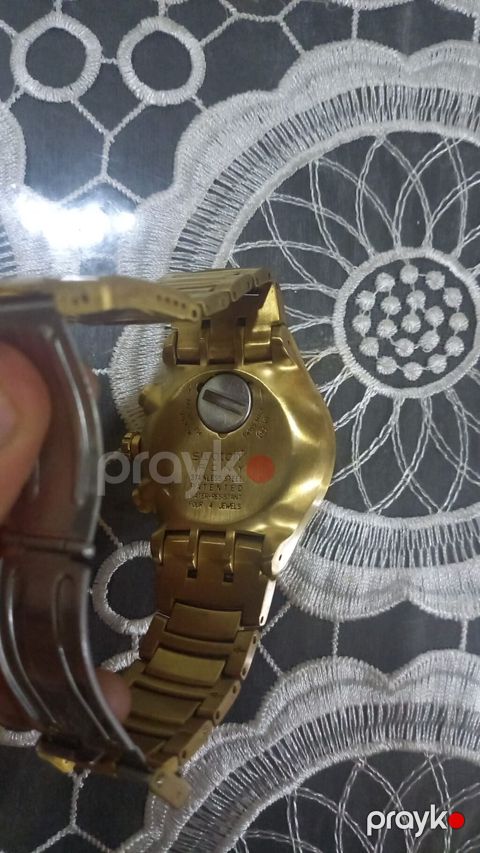 Swatch Irony qol saatı. Saat qızılı rəngli metal korpus və metal