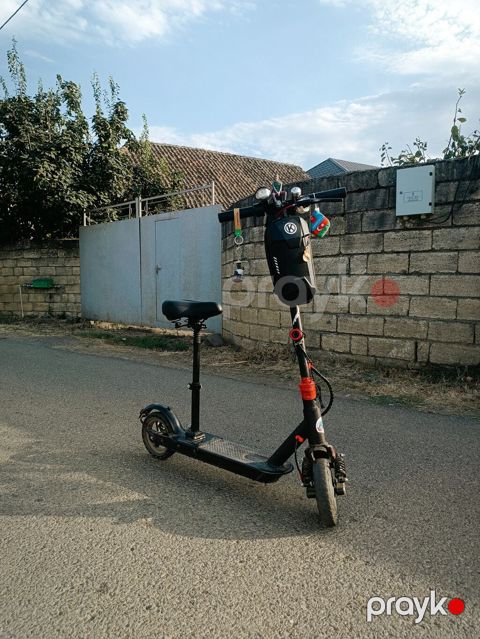 Elektrik skuter – oturacaqli sürət-maks 35 məsafə-25-30 skuterin