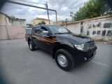 Mitsubishi L 200, 2010 il — Cars