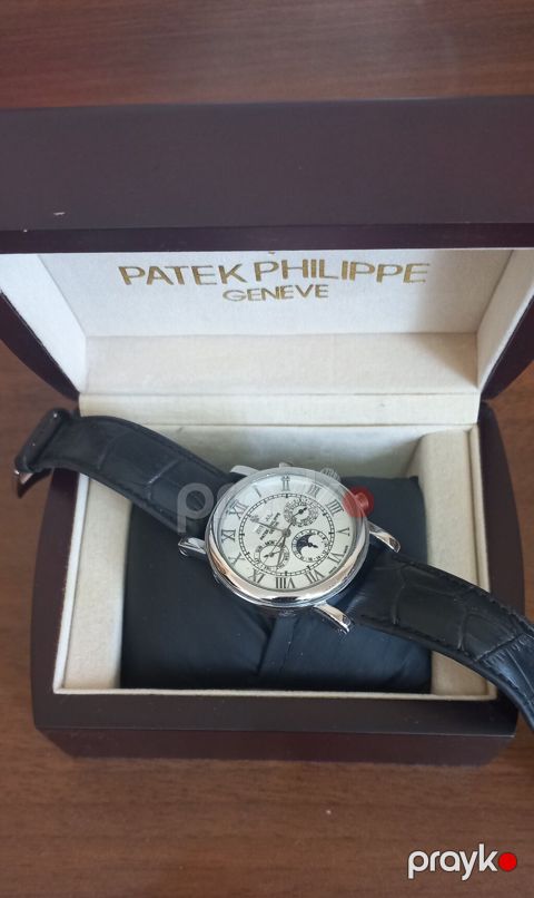 Patek Philippe Geneve üslubunda klassik dizayna malik mexaniki qol