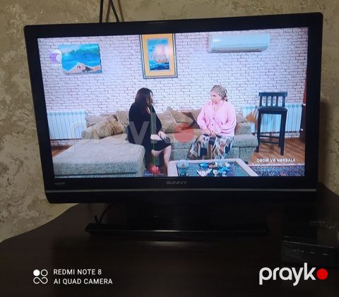 Sunny televizor satılır. Qara çərçivəli, masaüstü altlıqlı modeldir — Pirəkəşkül