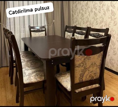 Acilan masa desti satilir 8 stul daxil. *Qiymeti 330 Azn.* Unvan — Bakı