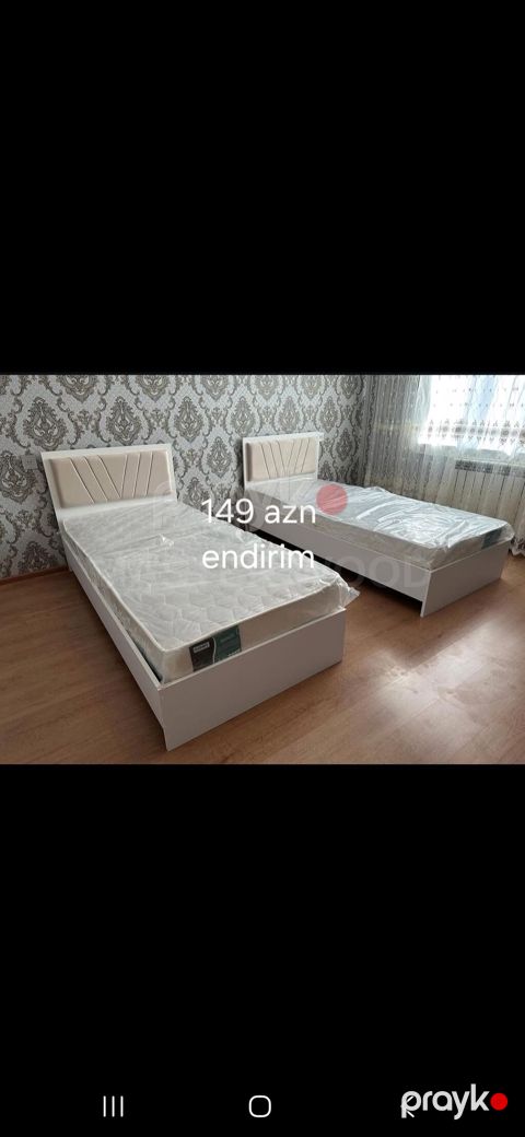 Açıq rəngdə, müasir dizaynlı tək nəfərlik çarpayılar. Yumşaq, yastı — Xırdalan