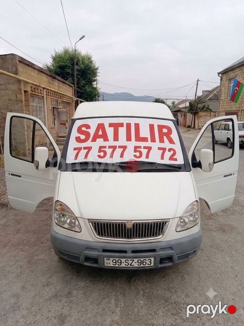 Ağ rəngli yük/miniven tipli avtomobil. Xüsusiyyətlər: - Kuzov: yüksək — Quba