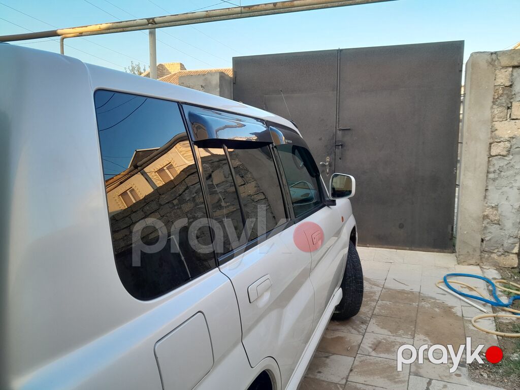Mitsubishi Pajero IO (5 qapı), ağ rəng, avtomatik ötürücü. - Tam — Avtomobillər, Digah (2)