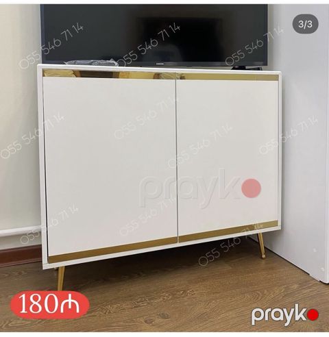 Ağ rəngdə, minimal dizaynlı iki qapılı dolab/TV altlığı. Üst və alt — Bakı