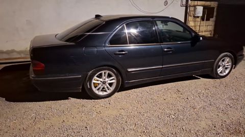 Mercedes‑Benz E‑Class (W210) sedan - Korpus: qara rəng, 4 qapı, xrom — Lənkəran