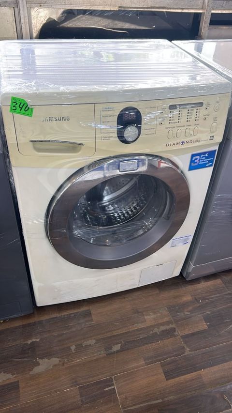 Samsung paltaryuyan maşın, ön yükləməli model. Korpus üzərində — Digah