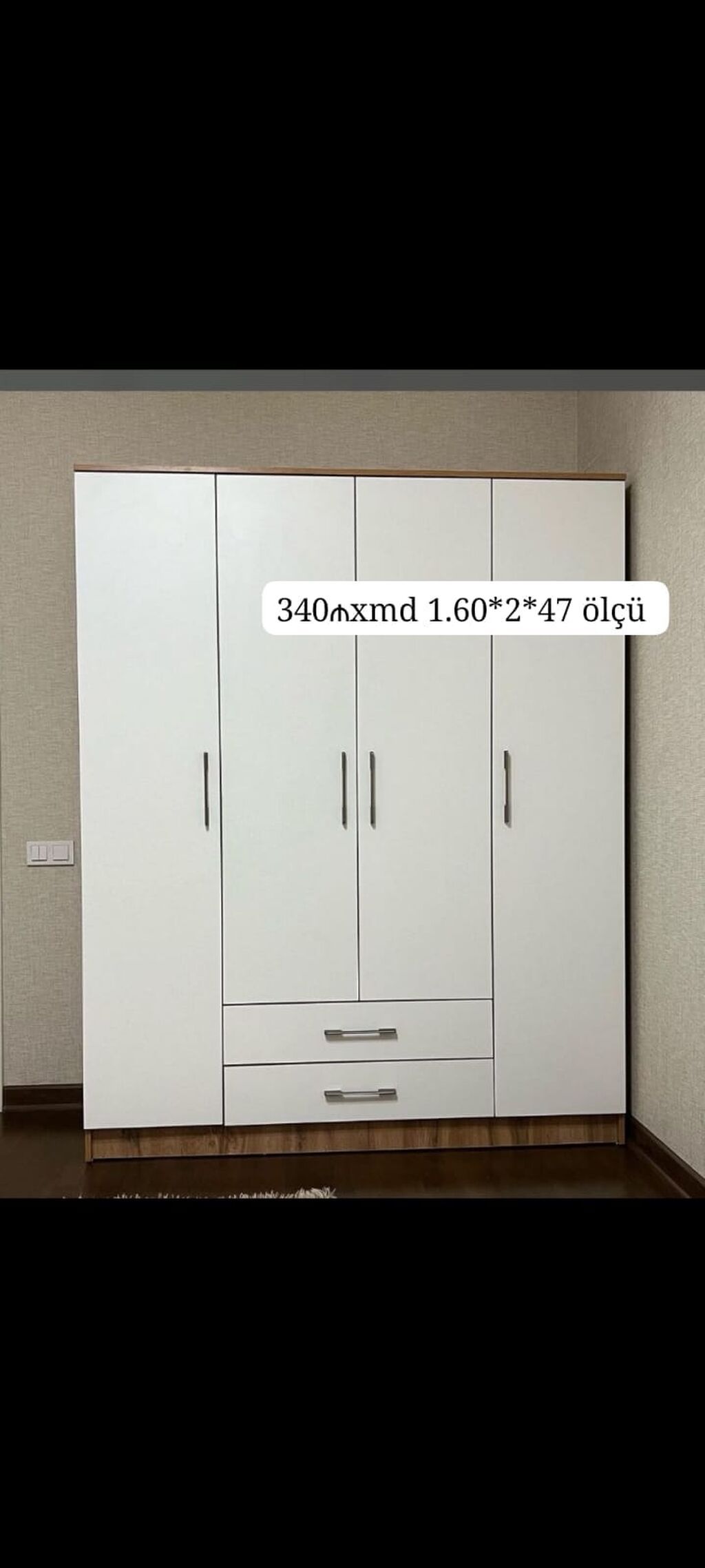 Ağ rəngdə 4 qapılı geyim dolabı. Aşağı hissədə 2 geniş çekmece var — Şkaflar, Mehdiabad