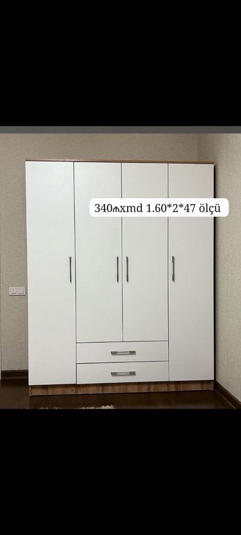 Ağ rəngdə 4 qapılı geyim dolabı. Aşağı hissədə 2 geniş çekmece var — Mehdiabad