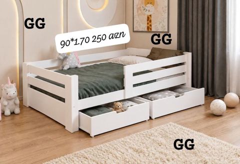Uşaq çarpayısı – ağ rəng, təhlükəsiz yan qoruyucularla. Alt hissədə — Mehdiabad