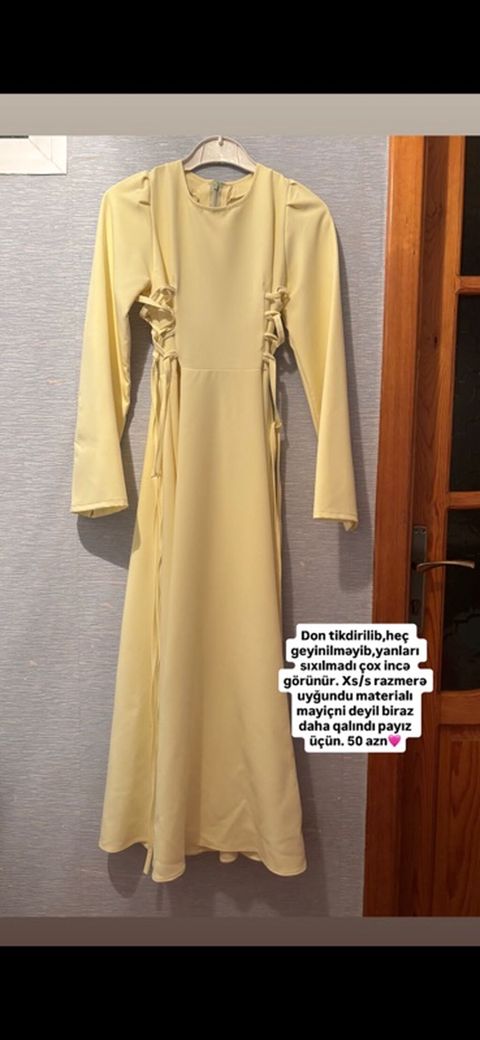 Açıq sarı rəngdə, uzunqol, uzun kəsimli don. Yandan bağlamalı — Bakı