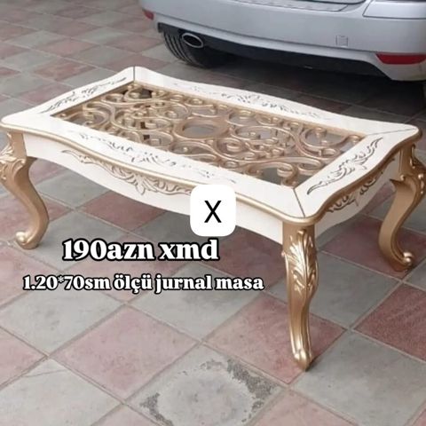 Jurnal masa – klassik üslubda, ağ və qızılı tonlarda dekor. Üst — Bakı