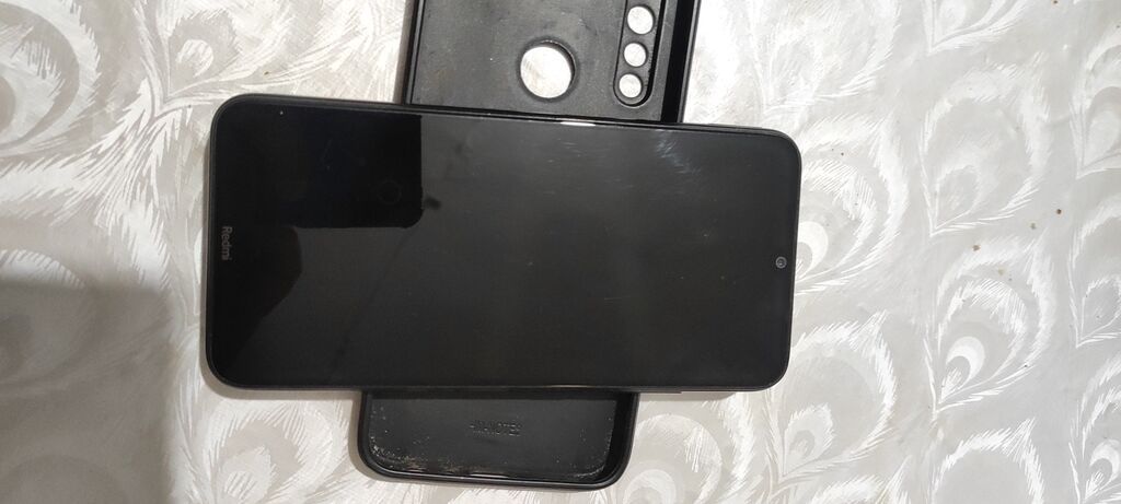 Redmi smartfon - Model: Redmi (arka blokda “48MP AI Camera” yazılı — Xiaomi, Bakı