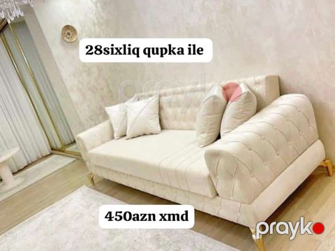 Zərif krem rəngli divan: yumşaq, kapitone işləməli yan hissələr və — Bakı