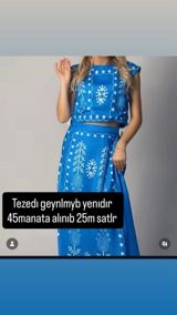 Mavi rəngli iki hissəli dəst – qolsuz qısa top və uzun ətək. Parlaq — Aytac