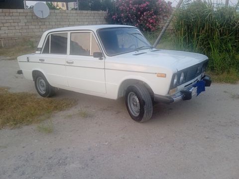 VAZ 2106, ağ rəngli sedan Xüsusiyyətlər: - Kuzov: 4 qapılı sedan
